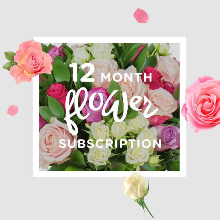 In this photograph, a lavish dome of roses is presented as the visual heart of a year-long flower subscription, like a calendar of seasons translated into petals for homes across Canonbury. The roses form a dense tapestry of colour: blush pinks reminiscent of early spring evenings, creamy whites that feel calm and timeless, bright fuchsia accents bursting with celebratory energy, and occasional dusky lavender tones adding depth and romance. Each bloom is framed by glossy, emerald green foliage that peeks between the petals, providing structure and contrast, much as the leafy trees along Canonbury Square frame the changing light through the year. Some roses are open wide, their velvety spirals fully revealed, while others remain as curled buds, promising that more beauty is always on the way. Soft, even lighting creates a sense of gentle radiance, as if the bouquet had been placed near a north-facing window in a quiet N1 living room, catching the natural daylight without any harsh glare. Scattered around the main cluster, individual petals and smaller blossoms drift like weightless fragments, giving the impression of roses slowly falling from the sky. This detail brings a touch of whimsy, evoking the feeling of unwrapping a fresh delivery each month, perhaps after strolling back from the shops on Upper Street. The overall composition is serene yet joyful, perfectly suited to any occasion where ongoing care is the message-whether marking a year of milestones, offering continued support, or simply ensuring that a home in Canonbury is regularly filled with the soft scent and quiet luxury of fresh roses artfully arranged by an experienced local florist.