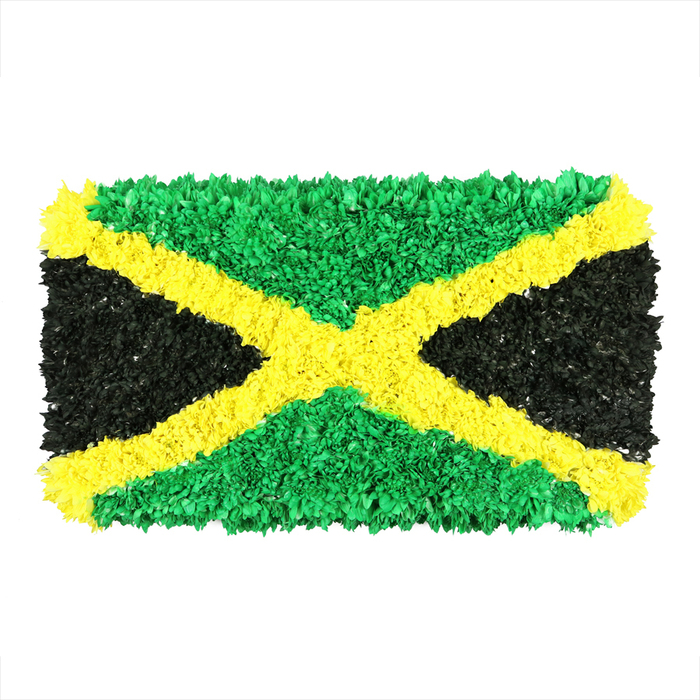 A vibrant, textured Jamaican flag reimagined as a densely packed collage of small, crinkled materials-perhaps recycled paper, fabric scraps, and other recyclable bits-centered on a clean white backdrop. The iconic gold saltire runs diagonally from corner to corner, its surface a mosaic of shimmering yellows that brighten the scene. The top and bottom triangles glow in rich emerald green, their edges softened by countless tiny folded pieces, while the left and right triangles present a deep, matte black that absorbs light with a gentle, velvety sheen. The overall effect is a striking three-dimensional composition where every fragment contributes to a tactile, almost sculptural finish. The handcrafted texture catches light in ever-changing ways, creating depth and motion that evoke a sense of Caribbean warmth and community pride. This version of the flag serves as a powerful visual for articles on Jamaican culture, celebrations, and identity, yet it remains distinctly local-an artful centerpiece that would resonate with Canonbury households, schools around Islington, or community halls near Newington Green, where neighbors gather to celebrate heritage. The piece invites quiet reflection as well as joyful admiration, a reminder of craft's ability to translate history into living art, suitable for same-day delivery across Canonbury and surrounding lanes.