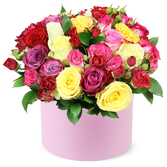 An opulent, generous bouquet rises in a soft pastel pink hat box, the dense cluster of roses filling the box to its rim. The palette blooms: deep crimson, bright yellow, fuchsia, soft pink, magenta, lavender, and creamy white, all arranged with a craftsman's precision to create a domed silhouette of abundant beauty. Large blooms open wide, their petals curling like velvet; interspersed among them are spray roses and petite buds that add texture and movement. Dark green leaves provide a glossy, forest-like frame that makes the colours pop and feel alive. The container's pale pink finish is smooth and refined, a quiet luxury that complements the roses rather than competing with them. This is a premium bouquet designed to convey deep affection for anniversaries, milestones, or meaningful apologies-an elevated gesture that shines in Canonbury's communities around Upper Street and Highbury Fields. It is available for same-day delivery across Canonbury and nearby Islington neighborhoods, ensuring a timely, fragrant reminder of your intentions.
