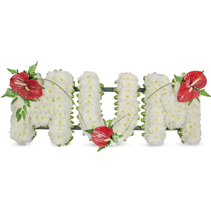 A poignant floral memorial spelling 'MUM' in elegant block letters, presented on a clean white field with quiet dignity. Each letter is meticulously formed from a multitude of pristine white spray chrysanthemums, chosen and packed so the surface becomes a continuous, plush expanse-soft to the eye, with minute petal textures that invite a gentle, contemplative gaze. The monument-like letters are softened by three striking red anthuriums, placed as thoughtful focal points: one on the upper left corner of the first 'M', another settled into the hollow of the 'U', and a third adorning the upper right of the final 'M'. Their waxy, heart-shaped spathes catch light and reveal the pale yellow-to-white spadix at each centre, offering a vibrant, warm note against the snowy chrysanthemums. Complementary dark green foliage-delicate fern fronds, broader glossy leaves and thin arching grass stems-frames each anthurium and sweeps between the letters, creating visual movement and a sense of continuity. A subtle dark green support frame peeks along the letter edges, lending structure and depth while keeping the focus on the blooms. Under soft natural illumination the arrangement exudes calm and reverence: the white speaks of peace and purity, the red of enduring love. As a sympathy or funeral tribute, it is a classic expression of honour for a mother, the sort of design that families in Canonbury, near Upper Street or Highbury, choose when they want something both traditional and tender.