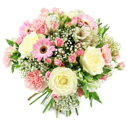 A round, generously packed bouquet is set against a crisp white backdrop, so the pastel flowers appear almost to float, as if just gathered from a carefully tended garden near Canonbury Square. Several creamy ivory roses open at the centre, their petals unfolding in precise layers that suggest timeless romance and quiet luxury. Nestled around them, clusters of pink spray roses provide a charming contrast in both size and tone, their smaller blooms and buds creating a sense of freshness and emerging joy. Bright pink gerbera daisies, with radiating petals and dark, textured centres, add a confident splash of colour that breaks up the softer shades and introduces a playful, modern note. Pale pink carnations, with their soft, ruffled edges, lend the bouquet a nostalgic feel, like flowers from a cherished family celebration held in a Canonbury townhouse. White alstroemeria stretch gracefully between the larger blossoms, their lightly speckled petals adding fine detail that rewards a closer look. Throughout the design, airy clouds of gypsophila weave in and out, forming a light veil that ties the different shapes together without hiding any of them. Subtle flashes of bright green foliage emerge from between the petals, offering contrast and echoing the leafy side streets around New River Walk. The stems are gathered neatly at the base, indicating a professionally crafted hand-tied design ready to be placed in a favourite vase or given as a thoughtful gift. The mood is gently celebratory and deeply affectionate, ideal for welcoming a new baby in the neighbourhood, sending soft congratulations, or simply letting someone in Canonbury know they're being thought of with sincerity and care.