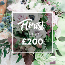 Elegance blooms in a Florist CHOICE bouquet, captured in a richly textured close-up by a Canonbury-area studio. The central white overlay carries Florist CHOICE and the price ?200, a quiet pledge of value within luxury. The arrangement unfolds in a refined mix of soft whites, creams, and blush pinks, with open light-pink garden roses at its heart, flanked by creamy white and pale lavender-grey roses and white anemones with dark centers. A dash of pale blue comes from spiky eryngium thistles, their steel-blue tips adding architectural bite. The bouquet is anchored by lush greens-eucalyptus-like foliage and deep burgundy leaves weaving through the stems to create texture and depth. The lighting flatters each petal, revealing satin-smooth surfaces, delicate crinkles, and the composition's generous scale, signaling a designer piece meant to be savored. The background blurs softly, inviting the eye to linger on the craft-the way stems are grouped, the balance of fullness and negative space, and the painterly interplay of color. It feels made for a special occasion, from weddings to anniversaries to a heartfelt gift, with reliable delivery across Canonbury and the wider Islington area. The local expertise behind the bouquet shines through, marrying timeless romance with contemporary restraint and a promise of fresh, seasonal blooms for your doorstep.