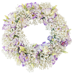 A serene circular wreath of fresh flowers appears to float against a bright white background, its form defined by an opulent bed of Baby's Breath and softly ruffled Lisianthus. The wreath's structure is made almost entirely from countless tiny florets of white Gypsophila, each stem branching into clusters that overlap generously, creating the impression of a snow-soft ring or a delicate cloud drifting over a quiet Canonbury street. Threaded through this mist of white, Lisianthus blossoms emerge as the focal flowers, their elegant, multi-layered petals curling slightly at the edges. These blooms are luminous white at the centre, then slowly deepen into strokes of violet, lavender, and purple along the outer rims, as though brushed by an artist's hand. A few buds remain partially closed, washed in pale green and cream, adding a sense of new life and gentle movement to the otherwise still composition. The circular form is clearly defined, with a wide, open middle that symbolises eternity and ongoing connection, a shape often chosen for funerals and memorials in Canonbury's churches and crematorium chapels. The overall palette of white and soft purple feels cool, calm, and contemplative, suggesting purity, faithfulness, and quiet strength. With no visible ribbon or extraneous decoration, the viewer's attention is drawn purely to the interplay of textures: the fine, airy Baby's Breath and the smoother, velvety Lisianthus petals. This type of wreath, the kind Canonbury Flowers often prepares for same-day delivery to local services and family homes, offers a refined, comforting expression of sympathy and remembrance.