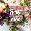 A close, intimate view of a lush, hand-tied bouquet held gently at the base by a pair of hands, the stems trimmed and framed against softly blurred, light-coloured clothing. The arrangement is a romantic tapestry of colour and texture: large, velvety pink garden roses with ruffled, peony-like centres sit at the heart, their delicate scent implied by the tight, juicy petals. Around them are deep plum-hued hellebore-like blooms that give a dramatic, velvety counterpoint, and slender, almost striped pale purple-and-white sweet peas that trail like ribbon. Soft peach and coral ranunculus-style flowers and creamy white accent blooms add luminous highlights, while abundant mixed foliage - from narrow, vine-like tendrils to broader, matte green leaves - creates depth and a garden-style, freshly gathered look. The lighting is soft and natural, catching the sheen on each petal and the subtle translucence of the sweeter tones.Centrally superimposed on the photograph is a thin white rectangular frame containing the words Florist Choice in an elegant script, with CHOICE rendered in smaller uppercase letters beneath, and a large ?100 in bold, sans-serif numbers at the bottom - a clear visual cue of a curated, premium offering. The overall mood is artisanal and celebratory: a bespoke, florist-selected bouquet that radiates quiet luxury and would suit weddings, anniversaries, or an especially thoughtful gift. The composition reads like a walk through a small Canonbury garden on a soft morning, the kind of arrangement a local florist might choose for someone you truly want to honour.