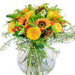 Bright and inviting, this handcrafted bouquet showcases the best of Canonbury's seasonal floristry. Sunflowers with dazzling golden rays and dark, velveteen centers command attention, while neatly cupped yellow roses cluster close by, their petals like spun gold catching the light. Scarlet Hypericum berries are thoughtfully nestled throughout, adding a burst of cheerful color akin to the joyful energy of Canonbury's local street fairs. The arrangement's abundant greenery creates a sense of movement: delicate ferns soften the edges, pale golden solidago and airy green spikes add subtle detail, and glimmers of blue-green eucalyptus lend a gentle, calming presence. Encased in a clear, globe-like glass vase, every fresh stem is visible, submerged in sparkling water for a crisp, contemporary touch. The overall effect is easy and uplifting, reminiscent of a sunlit stroll through the New River Path. The scent is gentle yet invigorating, with sweet notes of rose and airy greenery drifting together. Perfect for birthdays, anniversaries, or simply adding light to a Canonbury home, this bouquet channels optimism and artistry-crafted by local hands to brighten any occasion with authentic seasonal charm.