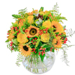 Radiating the golden brilliance of a Canonbury afternoon, this bouquet channels the essence of a joyful summer day in North London. At its vivid centre, sunflowers beam with bold, dark eyes and glowing petals, each one spilling sunlight outward and creating a sense of open-hearted cheer. Surrounding them, creamy yellow roses spiral into lush blossoms, their velvety texture promising happiness and hope. Striking orange accents and glossy red berry clusters intersperse throughout, sparking playful visual contrast and emotional warmth reminiscent of moments spent in the greenery of Canonbury's quiet enclaves. Wispy ferns and fine foliage frame the flowers, adding gentle movement and an airy, fresh-picked quality that connects to the local landscape. The hand-crafted arrangement, gracefully situated in a clear, rounded bowl, allows every stem to float serenely, visible through sparkling water-a subtle window to the bouquet's structured artistry. Subtle, refreshing fragrance rises - part sweetness, part the green scent of a newly cut lawn. Designed to uplift and delight, this bouquet suits birthdays, thoughtful thank-yous, or simply infusing a bit of sunshine into a home on Canonbury Grove, always reflecting the expert touch of Canonbury's local florists.