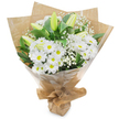 A serene, upright hand-tied bouquet in crisp white and deep green, photographed against a clean white backdrop and arranged with quiet precision. The eye is drawn first to a generous cluster of bright white, daisy-like chrysanthemums, each bloom fan-shaped with numerous delicate petals radiating from a sunny yellow centre that lends the composition a cheerful, honest brightness. Interspersed among these are several elongated lily buds in a pale green-yellow, some bearing faint striping along their protective tepals - they stand closed and expectant, promising fuller, softer blooms to come. Clouds of tiny white baby's breath (Gypsophila) drift between the larger flowers, their airy, pinpoint blossoms creating a gentle mist that softens edges and adds a feathered texture. Rich, glossy dark green foliage frames and supports the stems, heightening the contrast so the whites feel purer and more luminous. The bouquet is wrapped in an inner layer of crinkled brown kraft paper for an earthy, tactile counterpoint, then protected by a clear, glossy cellophane outer layer that catches the light and gives a polished sheen; the base is neatly gathered and tied so the arrangement stands upright for easy presentation. In soft morning light - the kind that filters through plane trees along Canonbury Square - the bouquet reads as both comforting and hopeful. The scent is clean and understated, a faint green sweetness with a whisper of fresh-cut stems and rain-soaked grass. This classic white mix suits moments of quiet sympathy, thoughtful get-well wishes, or understated congratulations, offering a composed, timeless expression when words alone feel insufficient.