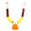 Against a crisp white studio backdrop, a U-shaped artificial flower garland is meticulously displayed, its symmetry and saturated hues immediately drawing the eye. The garland begins at the top of each arm with dense clusters of creamy, off-white florets-soft, pom-pom shapes that read like miniature chrysanthemums or tightly packed carnations-each petal catching the studio light and appearing almost silk-like. Directly beneath these pale sections sit compact bands of deep reddish-brown, textured pieces that resemble layered, flattened petals or dried leaf shapes; their muted warmth gives the design a grounded, earthy counterpoint. As the garland curves downward, the dominant middle section explodes into a bright, golden-yellow band of fluffy, marigold-like blooms, densely threaded to create a plush, continuous ribbon of colour. Small bright-green accents are threaded at the joins between colour blocks, suggesting leaf tips or knotted ribbon that add visual rhythm and a subtle fresh note. At the lowest center, where the two arms meet, a generous pendant of ruffled orange blooms hangs-a voluminous, multi-layered cluster that acts as the focal point and balances the composition with vibrant warmth. The materials read as durable, artificial fibres crafted for repeat use: light enough to hang across a doorway yet full-bodied in silhouette. Under the soft studio lighting the hues glow-white, reddish-brown, yellow, and orange-evoking ceremony and welcome. This toran-style mala, reminiscent of festive decorations seen on Canonbury doorways and local Chaple Market stalls, is conceived for puja altars, temple adornment, wedding entrances, or Diwali displays where a lasting, joyful presence is desired.