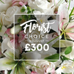 From Canonbury Flowers, this Florist Choice Bouquet is captured with a soft, intimate gaze, highlighting white roses and white lilies whose inner petals are pink-tinged, gently mingled with pale pink accents and fresh eucalyptus. The arrangement feels abundant yet refined, filling the frame with a calm, generous presence. A translucent white overlay sits in the center, bordered by a slender line, presenting the brand language: Florist in a delicate script, CHOICE BOUQUET in a clean uppercase sans-serif, and the price around £300 in bold white numerals. The bouquet's textures invite touch-velvet rose petals, satin lily petals, and the gentle rustle of eucalyptus stems-which conjure a garden's hush even in a studio shot. This image speaks to Canonbury's customers seeking a thoughtful, premium gift for anniversaries, birthdays, or sympathy, with the option of same-day delivery across Canonbury, Angel, and nearby Islington. The scene hints at careful hand-tied craftsmanship, a soft fragrance, and a sense of quiet celebration. The pristine white and pale pink palette conveys calm dignity, while the greenery provides a natural frame that keeps the blooms as the sole focus. In Canonbury's streets-Essex Road, Canonbury Square, and New North Road-this bouquet embodies refined generosity, a gesture that says you care deeply and want to share a moment of beauty with someone special.