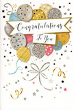 In this photograph, a tall congratulations card is shown upright, its front design glowing softly as though catching gentle daylight from a nearby Canonbury side street. The illustration centres on a lush cluster of celebratory balloons, loosely gathered like a bouquet, each balloon rendered in complementary shades of gold, silver, champagne, sky blue, pastel pink, and mellow grey. Delicate metallic details run across them: fine glittering stripes, tiny stars, and scattered specks of confetti that create a sense of depth and texture, almost as if the balloons were dusted with stardust. They are bound together by flowing ribbons in shimmering gold and silver, drawn with sweeping, calligraphic lines that twist and curl towards the base of the card, echoing the graceful movement of ribbon we often tie around fresh arrangements at Canonbury Flowers. Around the central cluster, small metallic stars, playful curls, and confetti dots drift across a soft, light background, evoking the carefree energy of a surprise party that might follow a promotion, an engagement, or a proud exam result. Across the middle of the design, a refined banner stretches out, presenting the words Congratulations To You in an elegant, looping script that feels both personal and polished. The whole composition balances festivity with sophistication, making it suitable for many occasions-from celebrating a new job in the City to marking a special milestone at home. When paired with a bouquet, this card would offer not just a message but a mood: one of uplift, gratitude, and shared delight, encapsulated in shimmering, balloon-filled artwork.