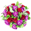 Captured from a top-down angle, this bouquet appears as a vivid, circular tapestry of red and purple blooms, strikingly outlined against a pristine white background that makes each hue seem even more intense. At the forefront are sumptuous red roses, fully opened to reveal their layered, spiralled hearts, their petals soft and velvety with a deep crimson colour that suggests passion and enduring romance. Nestled between these roses are plentiful purple carnations, their edges delicately serrated and ruffled, building a rich, almost feathery texture that ripples across the arrangement. The carnations shimmer in tones of bright magenta and royal purple, bringing an exuberant, celebratory feel. Cradling the blossoms is a mix of foliage: broad, glossy dark-green leaves lend structure and a sense of lushness, while scattered stems of eucalyptus introduce silvery-green highlights and the imagined lift of a cool, herbal scent. The bouquet is densely composed into a rounded, almost domed shape, giving it an opulent, overflowing character, as if no space was left unfilled. It feels like the kind of hand-crafted design created by a seasoned Canonbury florist for a special delivery to a townhouse near Newington Green or a candlelit dinner off Liverpool Road. The overall mood is both romantic and joyful-perfect for anniversaries, engagement celebrations, or simply sending a powerful message of affection and appreciation to someone in Canonbury and the surrounding neighbourhoods.