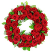 A deeply symbolic and visually striking circular wreath of dozens of vibrant deep red roses rests against a pristine white backdrop, as if touched by a quiet vigil. The wreath forms a continuous ring with blooms at every stage-from tightly furled buds hinting at future radiance to elegantly opened petals revealing velvety depth. The crimson hues vary subtly, catching the light and lending a living shimmer to the arrangement. Interwoven among the roses are clusters of fresh green foliage-broad, matte eucalyptus-like leaves and sharper, glossy ruscus-creating a lush contrast that enhances the warmth of red and the circle's solemn grace. The arrangement feels full, almost sculpted by careful hands, giving it a three-dimensional presence that reads as both dignified and intimate. 

The white background isolates the wreath, letting the textures sing: the soft fuzz of petals, the satin sheen of new leaves, and the quiet geometry of the ring itself. This is a piece that speaks of remembrance, of eternally circling memory, and of consolation offered in times of loss. In Canonbury, near the green of Canonbury Square and the lively bustle along Upper Street, such a wreath would sit as a heartfelt tribute at a funeral, memorial service, or anniversary, its red bloom language conveying love, respect, and enduring sympathy. It would be delivered with care across Islington and the surrounding districts, arriving freshly arranged and fully fragrant, ready to accompany a moment of quiet reflection and connection with those who remain. A true expression of solace, crafted with skilled floristry and local sensitivity.