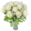 A serene, luminous bouquet of large, fully opened white roses fills the frame, each bloom showing soft, velvety petals that spiral outward in satin-like layers. Several roses reveal a faint creamy-yellow wash at their tightly furled centres, lending gentle warmth to the otherwise pure ivory faces. Interwoven between the roses are airy sprays of baby's breath (Gypsophila paniculata), their tiny clustered blossoms drifting like morning mist and giving the composition a cloud-like softness that cushions the stronger rose forms. Beneath and around the blooms, a variety of lush green foliage fans and frames the bouquet - glossy leaves and matte, textured greens create depth and a lively contrast that grounds the pale petals.
The arrangement is presented in a classic clear glass vase with a slightly flared lip, visible at the lower edge of the picture, where neatly trimmed stems descend into bright clear water. Even, natural lighting bathes the flowers from the front, sharpening the subtle folds of each petal and making the whites appear radiant without harsh shadows. The overall impression is one of quiet dignity and tender comfort - a composition well suited for a wedding aisle, an anniversary table, or a sympathy gesture intended to offer calm and solace. As a local florist familiar with Canonbury and nearby Newington Green, I picture this bouquet placed on a simple wooden table in a north London flat, its gentle fragrance a soft, reassuring presence in an otherwise hushed room.