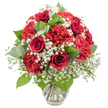 A classic red and white bouquet, full and rounded, stands in a clear glass vase against a brilliant white background, every detail lit with clean, even studio light. The composition is dominated by rich, velvety red roses-six to eight clearly visible-each one a tight spiral of petals that suggests quiet promises and enduring devotion. Intermingled with the roses are numerous crimson red carnations, their ruffled petals layered like fine fabric, adding generous volume and a sense of playful texture that softens the formality of the roses. Between these bold red blooms, white baby's breath appears in airy clusters, its tiny, cloud-like flowers floating gently through the arrangement, brightening the palette and enhancing the sense of purity and calm. Green foliage provides a natural frame: eucalyptus with its round, silvery-toned leaves mingles with richer, darker greenery, filling the spaces between flowers and guiding the eye upward through the bouquet. The stems are gathered tidily in a simple, flared glass vase filled with clear water, the transparent container allowing the natural lines of the stems to remain part of the visual story while ensuring the flowers are clearly the focus. Crafted with the practiced hand of a Canonbury florist familiar with intimate dinner parties off Upper Street and quiet celebrations near Highbury Corner, this arrangement captures both festivity and tenderness. The red and white palette, strong yet gentle, makes it ideal for Valentine's Day, anniversaries, or sending love and support to friends and family across Canonbury, whether as a centrepiece on a polished table or a bright welcome on a hallway console.