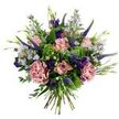 A hand-tied bouquet captured against a crisp white backdrop that feels like a small, private meadow brought indoors. At the heart of the arrangement several soft, antique-pink roses-some tightly furled, others gently unfurling-show delicate, slightly darker pink edging on their petals; nearby, two full-bodied carnations in a dusty rose or mauve-pink offer ruffled, velvety texture that invites the fingertips. Tall, slender spikes of deep indigo-to-violet Veronica rise like graceful brushstrokes through the composition, giving the bouquet vertical rhythm, while clusters of small, light lavender-blue aster-like blooms with tiny yellow centers scatter a playful, wildflower note across the surface. Deeper jewel tones come from a few rich purple eustoma or lisianthus blooms and buds, their satiny cups punctuating the softer pastels. The arrangement sits cushioned in varied greenery-a wash of rounded, silvery-green eucalyptus leaves that cool the palette and vivid lime-green, bushy filler (reminiscent of Santini or viburnum clusters) that lifts the whole design with fresh brightness. Slender green leaves and emerging buds thread between flowers, reinforcing an organic, just-picked feel, and the gathered stems at the base are visible, confirming a classic hand-tied construction. Soft lighting reads the layers of petals and the subtle, humid scent of fresh blooms, evoking quiet celebration and affectionate thoughtfulness. This bouquet's balance of pastel romance and jewel-toned accents makes it ideal for gifting-birthdays, thank-you gestures, or simply to brighten a favourite room-and it carries the gentle, perennial charm of a breezy English garden.