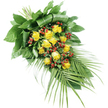 An elongated sympathy spray of yellow roses and red berries is meticulously arranged on a stark white background, creating a clear view of every stem and leaf. The design flows diagonally from the upper left corner down towards the lower right, shaped to rest smoothly on a coffin, memorial plinth, or church stand within Canonbury's quiet chapels. At its heart lies a generous grouping of yellow roses, their colour somewhere between soft butter and rich gold. Around fifteen to twenty blooms appear in different stages of life: some are still partially closed, with their petals wrapped protectively around the centre, while others are wide open, showing layered, velvety petals that suggest warmth and affection. Threaded between these roses are clusters of bright red berries, likely Hypericum, each tiny orb glossy and rounded, offering a vivid contrast that catches the light and breaks up the softness of the petals. A lush array of foliage cradles the flowers. Towards the top left, broad, dark green leaves are folded, wrapped, and layered to create a rich, cushioned base with a slightly architectural feel, as if tailored by a professional florist familiar with the tastes of Canonbury families. From the bottom right, long, slender palm fronds stretch outward, their fine, pointed leaflets giving the arrangement a flowing, almost wing-like silhouette. The mixed greens, in both deep and mid-tones, add depth and freshness, reminiscent of local parkland planting. Overall, the spray conveys dignity, serenity, and gentle warmth, making it a fitting floral tribute for funerals, memorials, or farewell ceremonies across the Canonbury and Islington area.