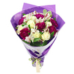 A sophisticated, hand-tied bouquet is displayed against a clean white background, allowing its vibrant colours and thoughtful design to shine. At the top of the arrangement, creamy white roses unfold in soft spirals, their petals velvety and pristine, giving the bouquet a romantic, timeless heart. Surrounding them, deep magenta and fuchsia carnations form lush, ruffled clusters, each bloom densely petalled and full of movement, creating a rich contrast with the smoother roses. Slender stems of white alstroemeria weave between these focal flowers, their narrow petals traced with subtle pinkish-red streaks and punctuated by dark stamens, adding a refined, almost painterly detail. A generous scattering of green foliage frames the flowers, with glossy leaves and lightly variegated edges that introduce a natural, garden-fresh energy reminiscent of Canonbury's leafy streets and nearby New River Walk. The arrangement is carefully shaped into a rounded dome of blossoms, with the stems gathered tightly beneath, then wrapped in multiple layers for a polished finish. Closest to the blooms is a crisp white paper collar that encircles the flower heads, clean and architectural, making the colours appear even more vivid. This is overlaid with an outer layer of translucent purple cellophane or tissue, its crinkled texture catching the light and adding sparkle, as if the bouquet were ready to head out from a Canonbury florist for a special doorstep surprise. At the base, an iridescent bright green satin ribbon is tied in a neat bow, from which hangs a small, rectangular light brown tag, blank and inviting a personal message. The bouquet feels joyful, celebratory, and heartfelt, ideal for birthdays, anniversaries, or simply brightening someone's day in Canonbury.