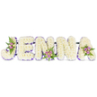A tender, sculptural floral tribute spells the name JENNA in bold, three-dimensional block letters arranged horizontally against a clean white backdrop. Each letter is densely clothed in hundreds of small, creamy white chrysanthemums-or similarly textured florets-so the surface reads as a soft, cloud-like field that both absorbs and reflects light with a gentle matte sheen. A narrow band of vivid purple ribbon or tiny lavender blooms traces the inner edges of every letter, giving crisp definition and a quiet, respectful contrast to the white massing. Three small accent posies punctuate the display: one nests along the curve of the 'J', another sits near the center base of the first 'N', and a third rests on the upper right of the 'A'. Those clusters combine blush-pink and pale lavender spray roses with a few cream-to-pale-yellow roses, threaded through delicate dark-green fern fronds for cooling texture and movement. Thin, dark connecting bars run discreetly behind the letters, suggesting the sturdy framing that keeps the ensemble unified for standing or easel display. The arrangement's scent is soft and floral rather than heady-fresh chrysanthemums and roses offering a mild sweetness that suits the solemn, comforting mood of a funeral chapel or wake. As a personalised sympathy piece, the composition reads as a handwritten name rendered in blooms: intimate, reverent, and meticulously finished. An experienced florist would note the careful colour balance-white for peace, purple for remembrance, and pale pink for affection-making this tribute a composed and heartfelt memorial for a beloved called Jenna in and around Canonbury and neighbouring Islington communities.