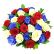 A rounded, overflowing bouquet of roses in red, white, and vivid blue appears vividly against a bright white studio background, creating a striking patriotic composition that feels at once modern and timeless. The roses are densely packed into a smooth dome, with around three dozen blooms pressed closely together so that their petals touch and overlap, forming a continuous surface of colour. Each rose is fully open, revealing layers of soft, velvety petals that curl gently at the edges; the rich red blooms convey warmth and devotion, the crisp white roses bring light and clarity, and the cobalt blue roses add a bold, almost regal note, reminiscent of flags and bunting often seen during celebrations across Canonbury and nearby Islington. The distribution of colour is carefully judged, so that no section of the bouquet is dominated by a single hue; instead, red, white, and blue alternate in a balanced, almost rhythmic way. Threads of dark green foliage peek out between the blossoms, their glossy leaves providing a fresh, natural counterpoint to the saturated petals and adding a sense of depth, as if glimpsing greenery through clusters of blooms in a local garden off Canonbury Square. The bright, even lighting in the photograph catches the subtle sheen on each petal and emphasizes the freshness of the roses, suggesting carefully conditioned flowers prepared for same-day delivery. The result is a visually impactful, emotionally resonant bouquet that would serve beautifully as a centrepiece for national celebrations, remembrance gatherings, or proud family occasions across Canonbury, where themes of unity, gratitude, and shared heritage are at the heart of the event.