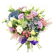 This bouquet, thoughtfully designed in the spirit of Canonbury's refined community, conjures a feeling of abundant joy and tranquil sophistication. The visual focus lands on sumptuous hydrangeas in jewel-toned indigo, teal, and dusted violets, whose generous clusters form a plush, textured heart. Woven within are soft lavender and creamy white roses, their velvety petals exuding an air of gentle calm and quiet refinement, familiar to those who wander the peaceful streets near Canonbury Road. Nestled beside these are pure white ranunculus, densely ruffled and full, providing a soft visual balance, while slender eustoma bring touches of buttery yellow that echo the first sunlight over Islington's rooftops. Fuchsia-pink filler flowers burst with lively contrast, and sprays of feathery pink astilbe soften the bouquet's outline, lending a sense of whimsy a local would recognize from springtime in Arlington Square Gardens. Veils of delicate, almost translucent green-white filler blooms dance among lush emerald foliage, deepening the palette. A luxurious, wide royal purple satin ribbon binds the stems, tying together cool hues and adding a sophisticated London finish. Fragrant and inviting, this arrangement is made for moments of celebration or appreciation-a thoughtful, professionally crafted bouquet that brings a piece of Canonbury's floral elegance into any home.